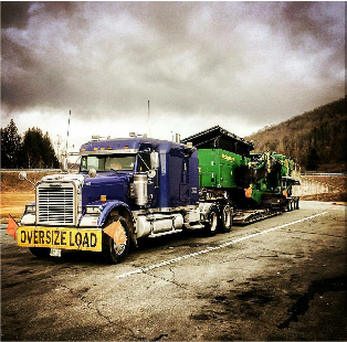 A massive truck hauling a trailer, ready to transport goods efficiently.